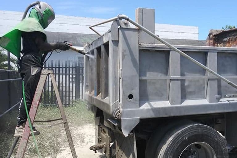 Heavy equipment prepared with mobile sandblasting service